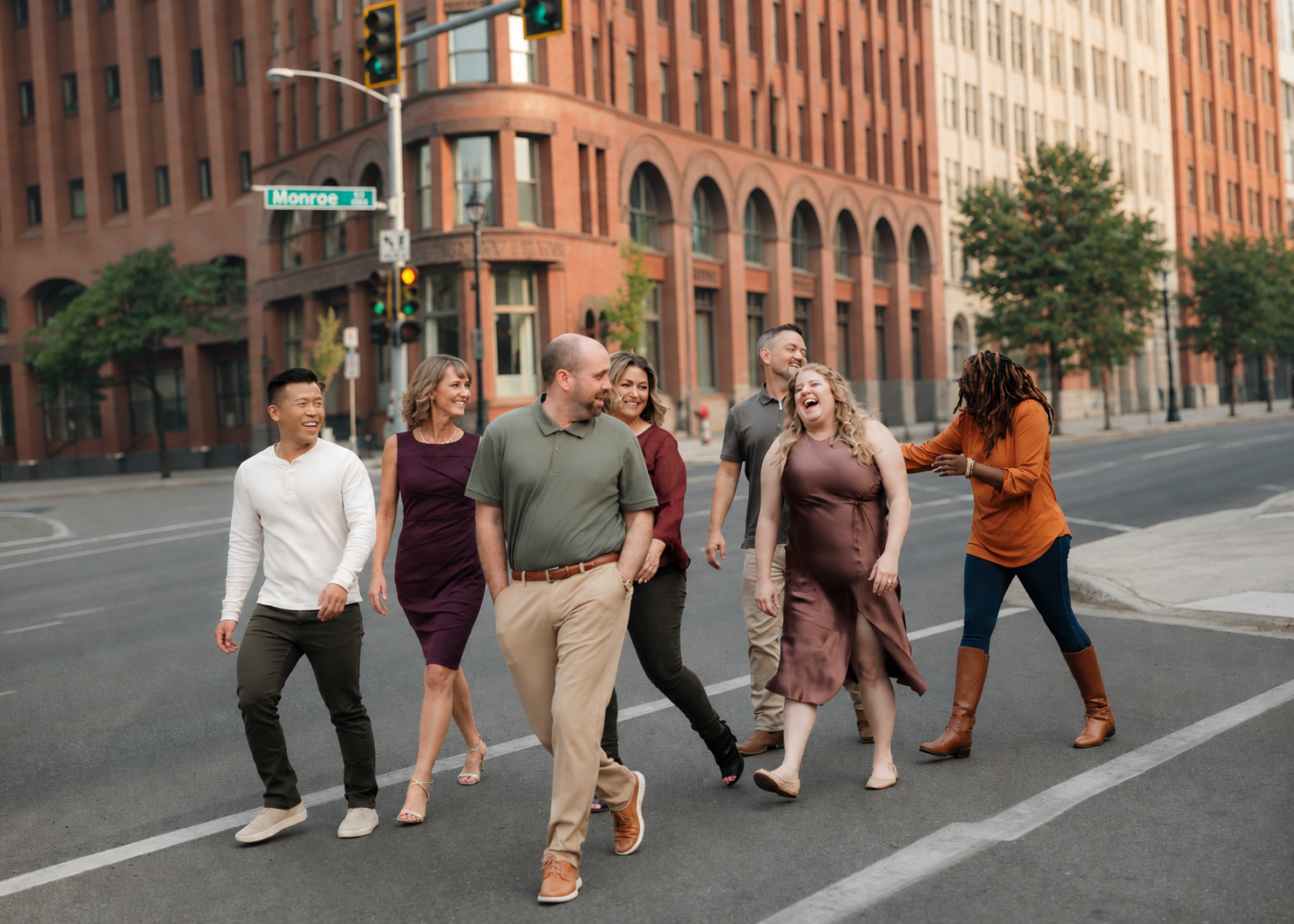 The seven Dance With Spokane! community leaders walking together in Downtown Spokane